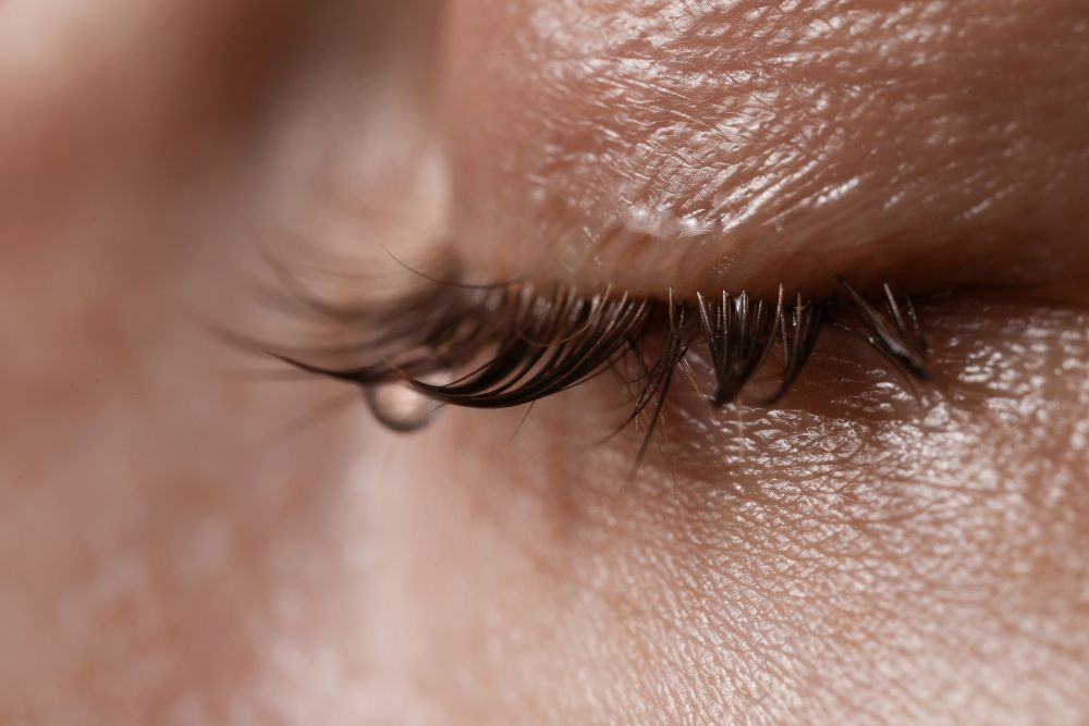 Woman at the gym protecting her lash extensions after a workout
