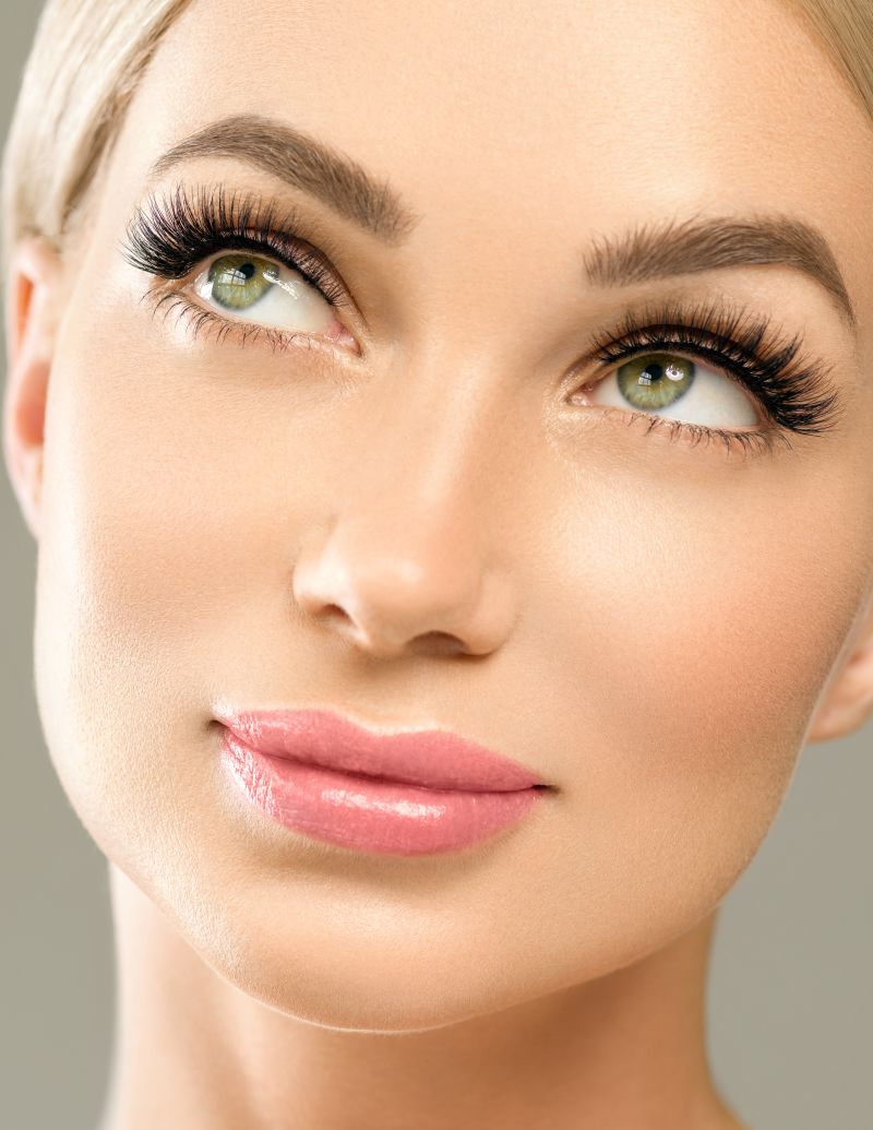 Close view of soft Siberian mink eyelash extensions blended with natural lashes