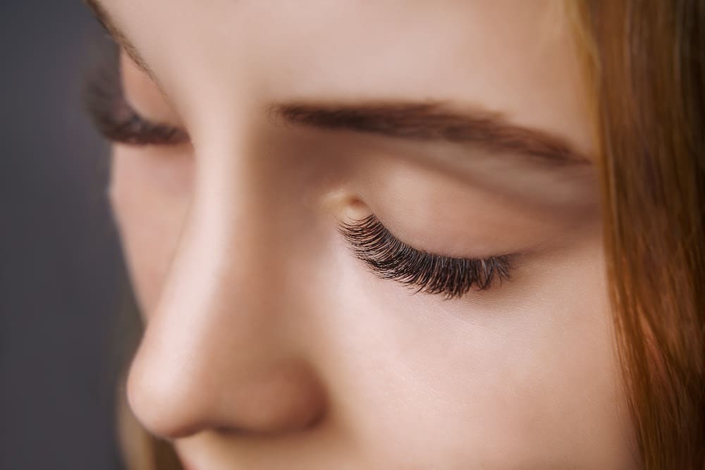 Close-up of silk lash extensions enhancing natural eyelashes